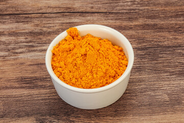 Tumeric powder in the bowl