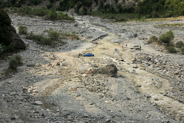 The river washed away the road to the village.
