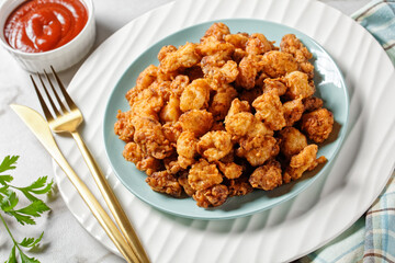 Popcorn chicken - american fast food on a plate