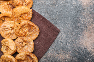 Tasty dried figs on grunge background