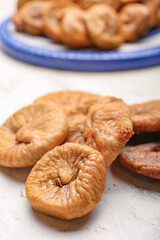 Tasty dried figs on table
