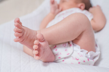 Little foot of a cute, adorable newborn girl