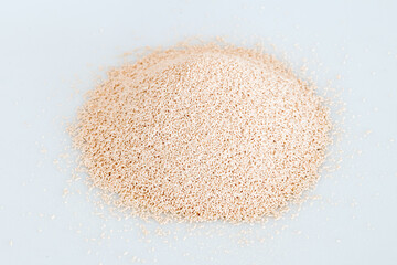 Active dry yeast on white background.