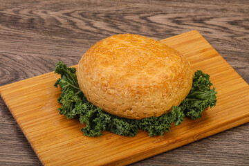 Smoked Georgian suluguni cheese piece