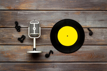 Vinyl record with microphone, music flat design background
