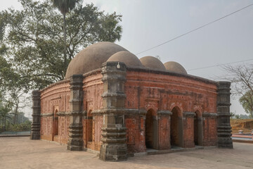Side view of beautiful medieval stone and brick with terracotta carving Sura mosque in Ghoraghat, Dinajpur district, Bangladesh