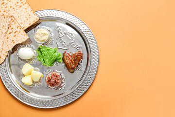 Passover Seder plate with traditional food on color background