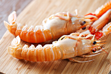 Raw scampi on cutting board . High quality photo.