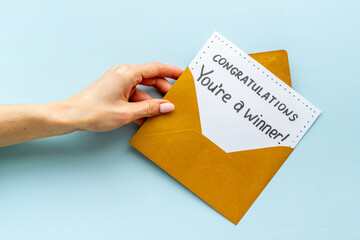 Congratulations award concept -You are a winner card in golden envelope