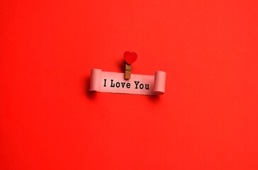 I love you label on torn paper with red paper background