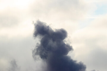 Dark cloud in the sky, smoke in the sky