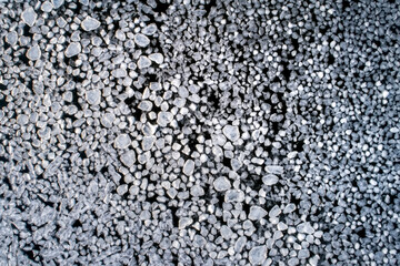 Frozen ice on as a background, a bird's-eye view. Textured surface