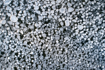 Frozen ice on as a background, a bird's-eye view. Textured surface