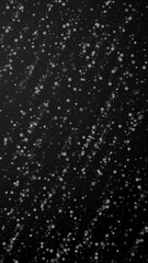 Beautiful snowfall Christmas background. Subtle flying snow flakes and stars on black background. Amazing winter silver snowflake overlay template. Alluring vertical illustration.