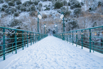 snowy bridge over the river duero