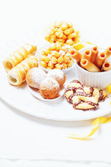 Traditional Carnival Italian fritters dusted sugar with honey and sprinkles.