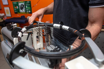 Stringing process of a new tennis racket, rocket string, sport concept