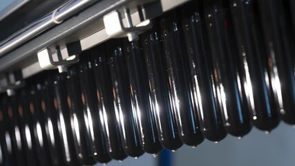 Fabricated parts for beer plastic bottles transported by automatic production line in brewery workshop closeup timelapse