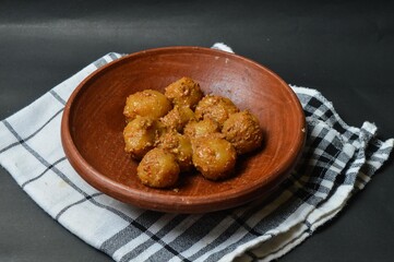 Cilok is balls prepared with a base of tapioca flour. Whether boiled or fried, cilok balls are typically accompanied by a sweet peanut sauce or spicy sauces based on ketchup and kecap manis. 