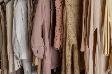 .Assortment of woman modern summer and autumn clothing in garment store. Shopping. Close up.