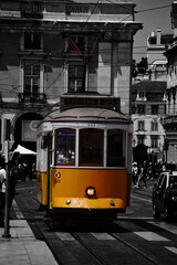 orange tram on the streets of Lisbon