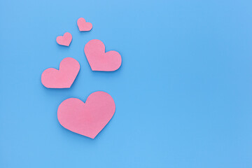 Fototapeta na wymiar Valentines Day or Mothers Day greeting card concept. Pink hearts , paper cut romantic concept