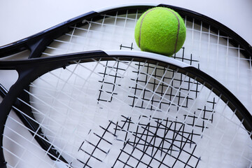 sports theme. tennis rackets and ball on white background