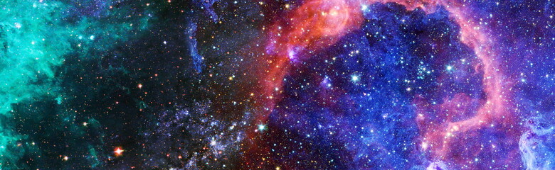 Colorful cosmos with stardust and milky way. Magic color galaxy. Infinite universe and starry...