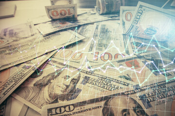 Multi exposure of forex chart drawing over us dollars bill background. Concept of financial success markets.