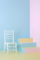 Minimalist interior with chair and colorful staircase with pastel colors wall, pastel colors background, fine art photo