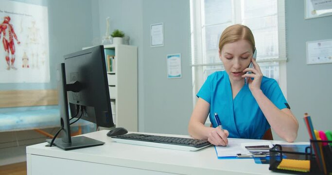 Pretty Caucasian female nurse calling patient to consult on analysis results. Young clinic worker talking on phone and checking ultrasound scan in doctor's office. Medicine, healthcare concept.
