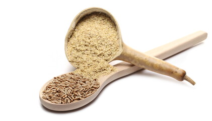 Wheat germ and spelt seed pile with gourd half and spoon, isolated on white background