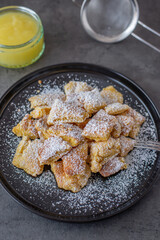 Austrian cuisine. Torn pancake (or omelet) kaiserschmarrn with honey, powdered sugar