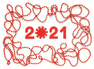 Red felt numbers 2021 on white background. Zero in the form of a covid virus. Red beads around. Flat lay for Valentine's Day or New Year. Review of the coronavirus year.