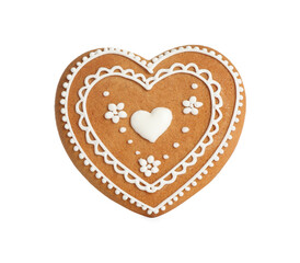 Gingerbread heart decorated with icing isolated on white