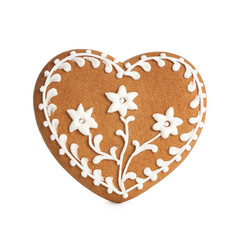 Gingerbread heart decorated with icing isolated on white