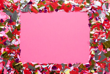 Frame of shiny colorful confetti on pink background, flat lay. Space for text