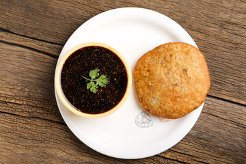 Kachori is a spicy snack from India also spelled as kachauri and kachodi. Served with tomato ketchup. Favorite Tea time snacks