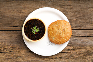 Kachori is a spicy snack from India also spelled as kachauri and kachodi. Served with tomato ketchup. Favorite Tea time snacks