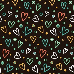 seamless pattern with small rainbow hand drawn hearts scattered on a dark background
