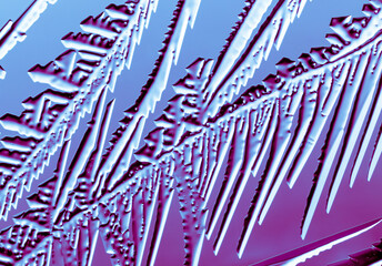 Fototapeta na wymiar Blue-pink patterns from frost on glass as a background.