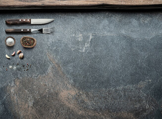 Table settings and empty graphite background. Top view of food background.