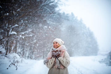 Fototapeta na wymiar Beautiful girl in amazing snowy land