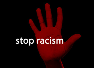 Stop Racism. Man showing hand on black background, closeup