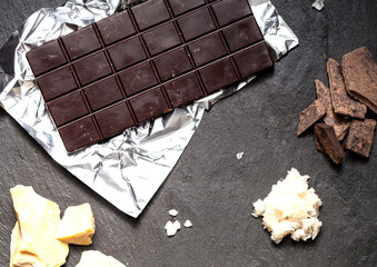 Handmade raw vegan chocolate on black background