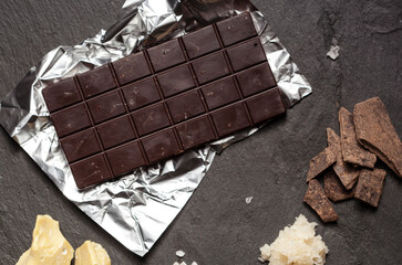 Handmade raw vegan chocolate on black background