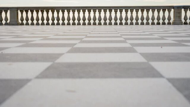 Leghorn, Tuscany Italy. Mascagni Terrace walking. Terrazza Mascagni, is a square overlooking the sea, with its very special black and white checkered floor. CINEMA RAW FOOTAGE