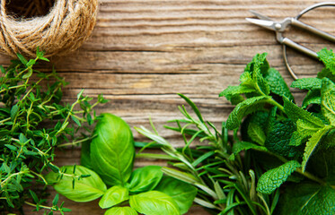 Fresh herbs  on wooden background top view