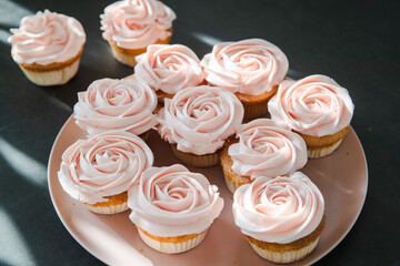 Cupcakes with butter cream on dark background