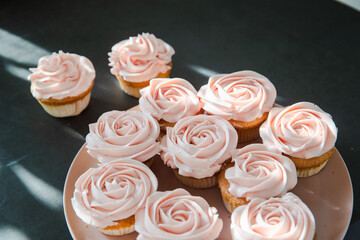 Cupcakes with butter cream on dark background